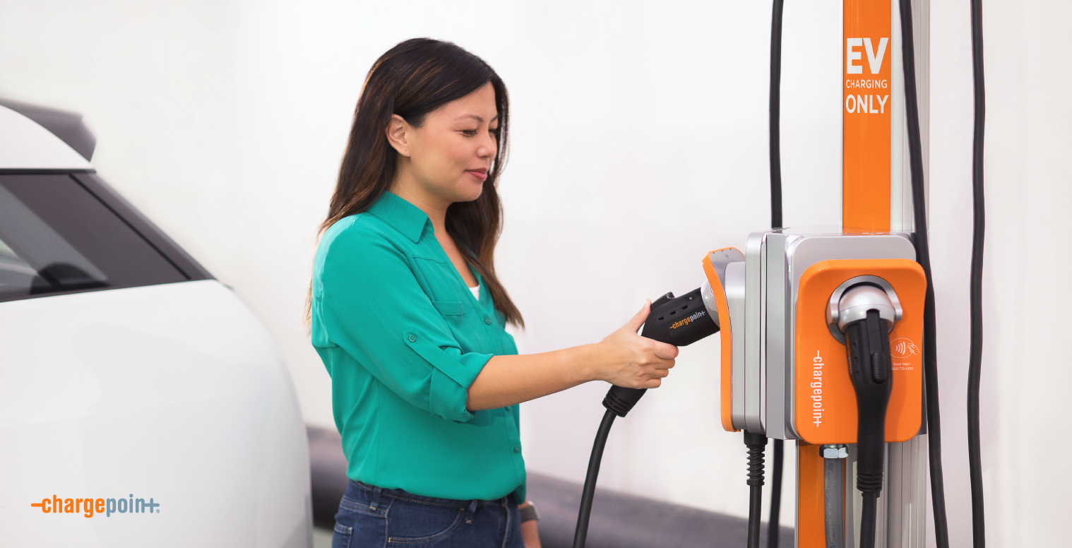 Woman charging EV 