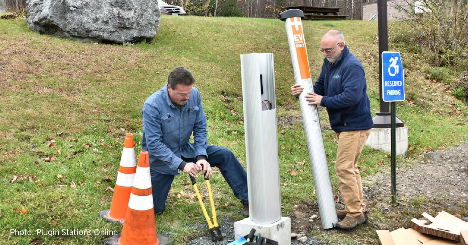 John Doran and an employee installing a ChargePoint station